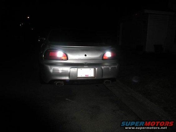 2002 Pontiac Grand Prix rear view, silver, with illuminated backup lights and dual exhaust tips