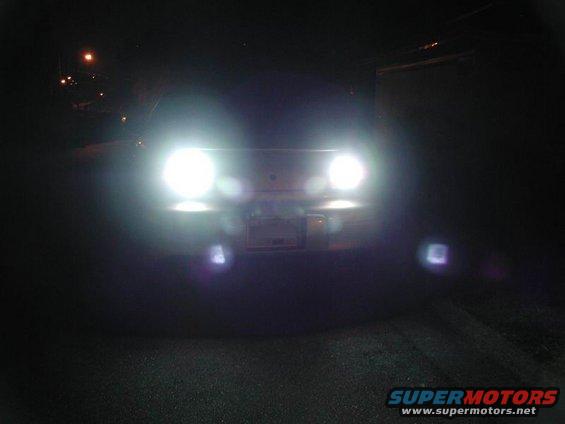2002 Pontiac Grand Prix front view with headlights on at night