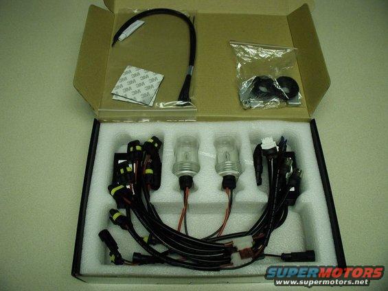 Boxed HID conversion kit with two bulbs, wiring harnesses, and 3M adhesive pads