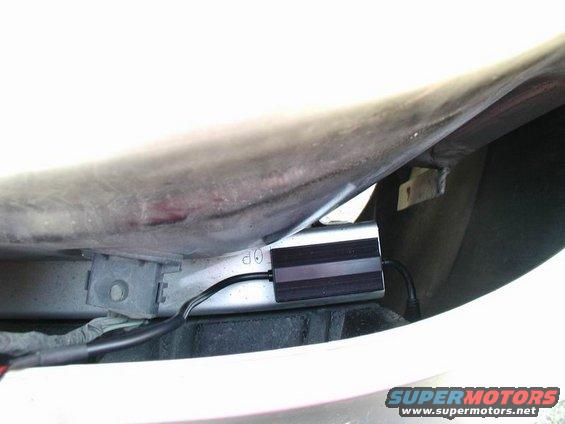 HID ballast and wiring attached to car bodywork