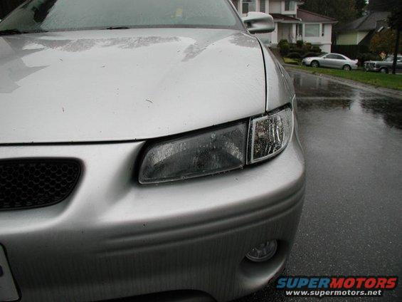 Silver 2002 Pontiac Grand Prix front end with clear corner headlights