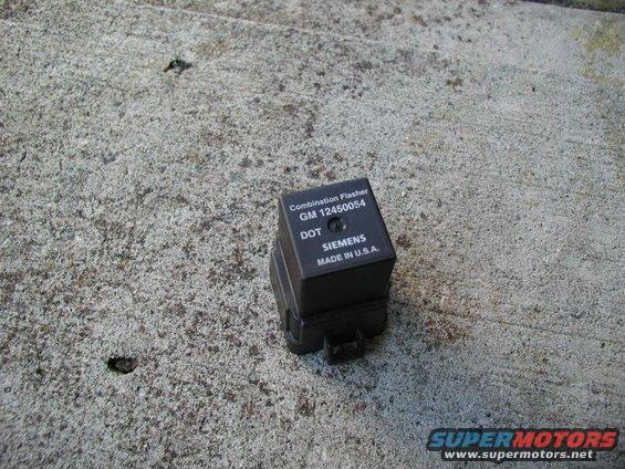 Black combination flasher part with GM 12450054 and Siemens markings