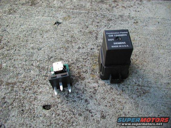 Two automotive electrical components, a black flasher relay with "GM 12450054 SIEMENS MADE IN U.S.A." text and a smaller switch, rest on a concrete surface