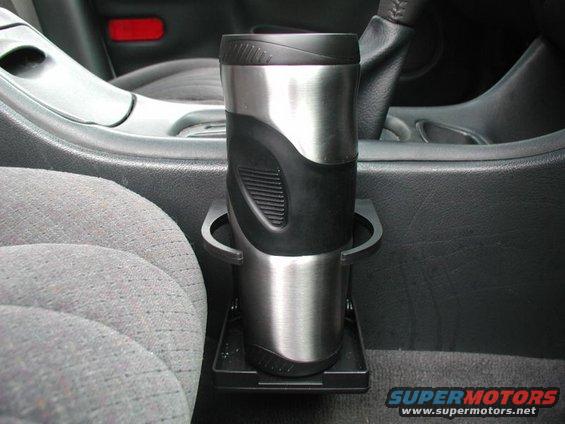 2002 Pontiac Grand Prix interior showing cup holder with travel mug and part of the passenger seat