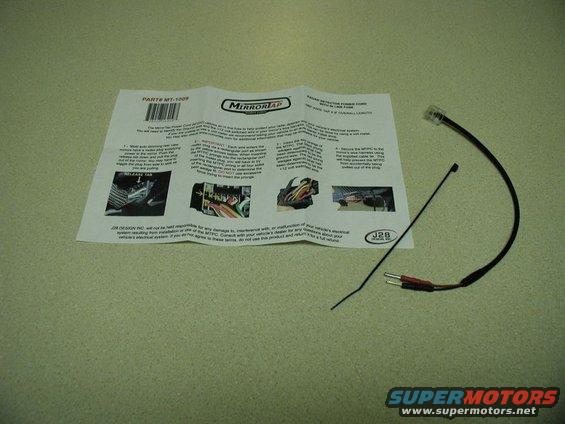 Radar detector power cord and installation instructions on a speckled surface