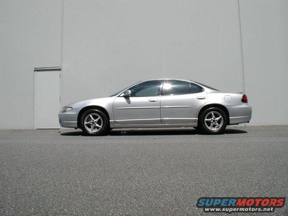 Silver 2002 Pontiac Grand Prix sedan parked outside