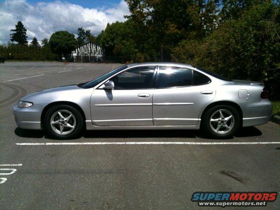 2002 Pontiac Grand Prix sedan, silver, parked in a lot