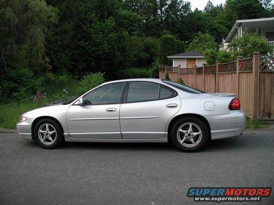 Silver 2002 Pontiac Grand Prix sedan, side view