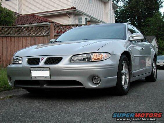 Silver 2002 Pontiac Grand Prix parked on street, front quarter view