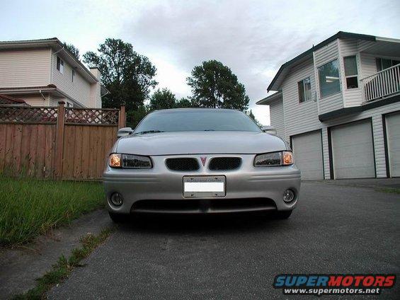 Silver 2002 Pontiac Grand Prix parked in driveway, front view