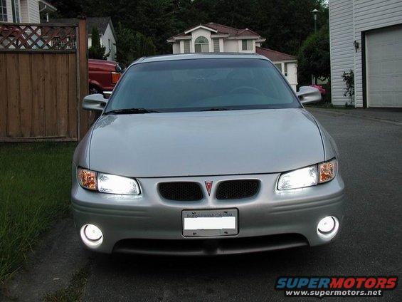 Front view of a silver 2002 Pontiac Grand Prix parked in a driveway