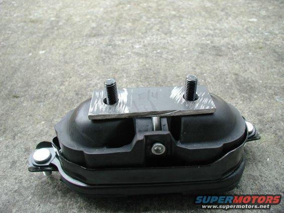 Engine mount with two bolts on a metal plate