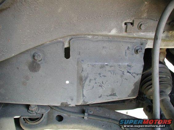 Underside view of vehicle suspension and undercarriage components