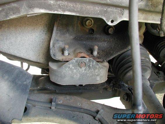 Close-up of a vehicle's engine mount and suspension components