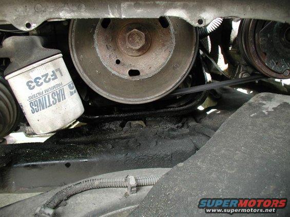 Engine belt and pulleys with a Hastings LF233 oil filter, showing oil residue
