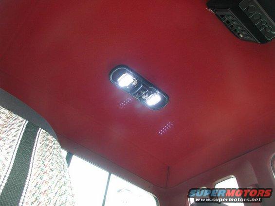 Red interior dome light assembly in a 1990 Ford F-250