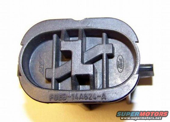 Close-up of a black Ford part with "FOEB-14A624-A" stamped on it and a Ford oval logo