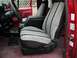 1990 Ford F-250 - The interior of a 1990 Ford F-250 shows off its patterned seat covers and a functional center console.
