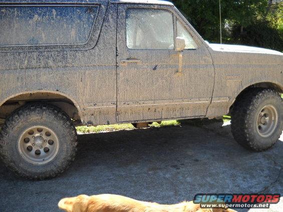 Side view of a mud-covered 1990 Ford Bronco