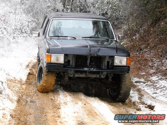 1990 Ford Bronco front view stuck in mud and snow