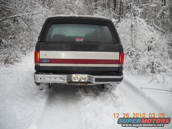 1990 Ford Bronco rear view in snowy woods