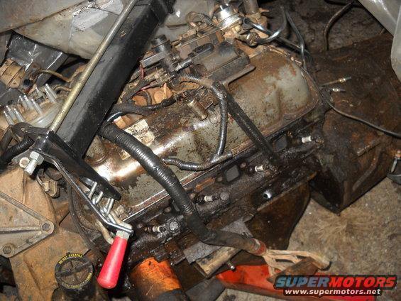 Engine block on an engine stand with a hoist attached