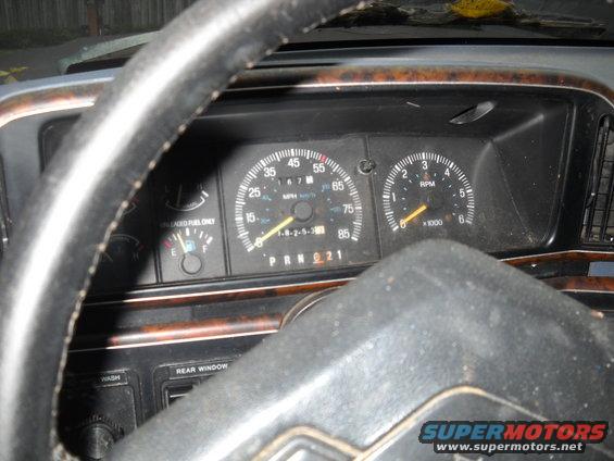 Dashboard gauges and steering wheel of a 1990 Ford Bronco