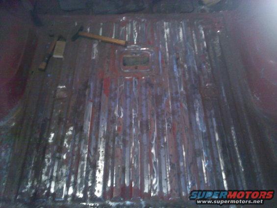 Vehicle interior floor with hammer and chisel
