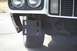 1976 Ford Ranchero - Front view of a white 1976 Ford Ranchero showing a black mounting bracket attached to the bumper.
