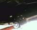 1984 Ford Bronco - Underside view of a vehicle's frame and suspension system, showing mounting points.