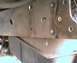 1984 Ford Bronco - This photo shows a close-up view of a vehicle's frame and suspension components, with visible rust and bolts.