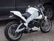 2003 Buell Lightning w/Fairing - A white Buell motorcycle is parked on concrete next to the side of a dark-colored truck.