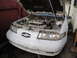 1992 Ford Taurus - Front view of a 1992 Ford Taurus SHO, hood up, revealing the engine compartment.