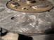 1992 Ford Taurus - Close-up of a heavily worn clutch disc, showing significant scoring and damage to the friction material.