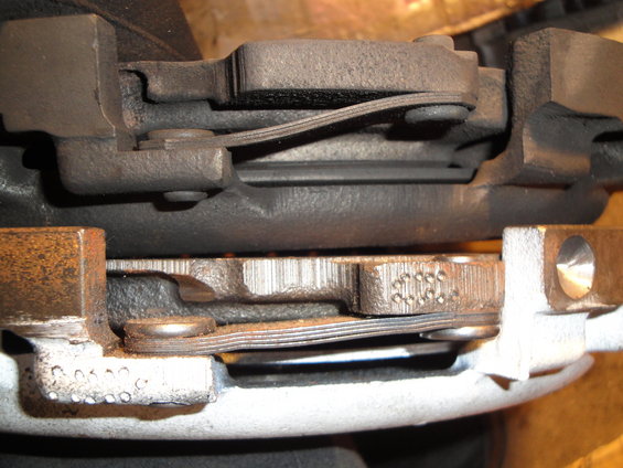 Close-up of a clutch assembly with metal plates and springs