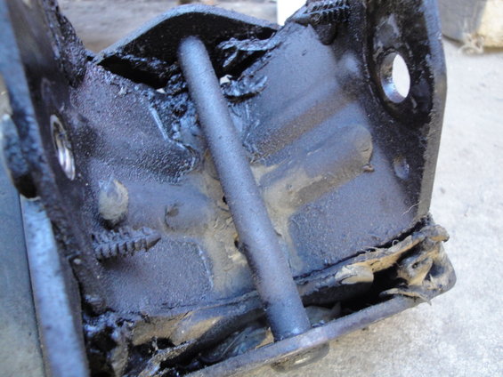 worn engine mount bracket with rubber isolator damaged