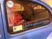 1970 Volkswagen Beetle - Rear window of a blue VW Beetle displays 'Lost Industries' and 'Karls Custom' decals.