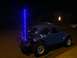 1970 Volkswagen Beetle - A modified blue Volkswagen Beetle, likely a Baja Bug, is seen at night with a bright blue LED whip antenna.