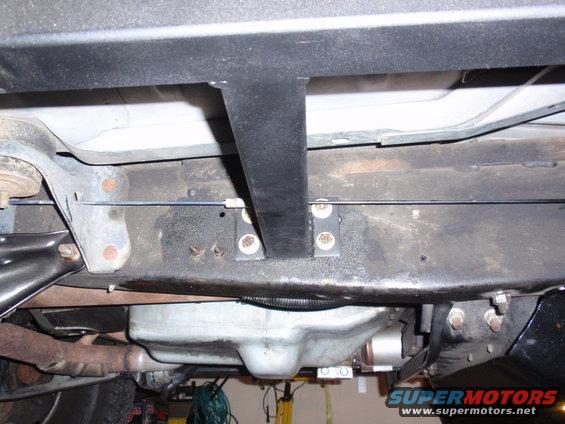 Underbody of a vehicle showing frame, exhaust, and fuel tank