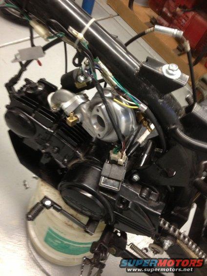 Motorcycle engine assembly with wiring harness and turbocharger components