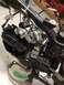 2003 Ford Crown Victoria - Close-up view of a motorcycle engine assembly, showing engine block, wiring, and turbo components.