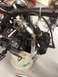 2003 Ford Crown Victoria - Close-up view of a motorcycle engine, showing the exhaust pipe and carburetor assembly.