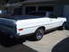 1973 Ford Ranchero - This white Ford Ranchero has a black bed cover and chrome wheels.