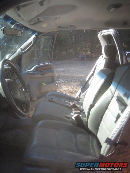 Interior view of a 2003 Ford F-350 showing front seats and dashboard