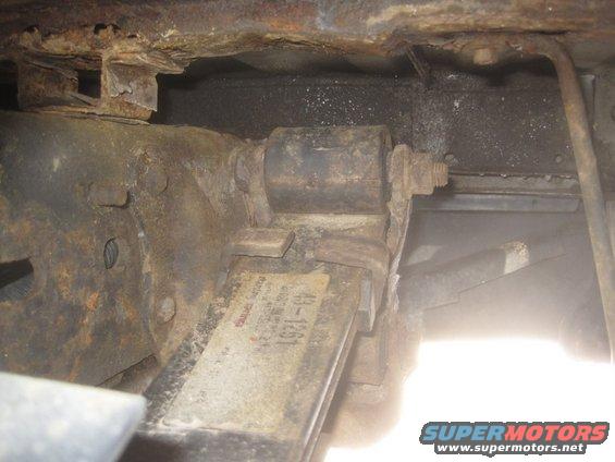 Rusty leaf spring assembly with a part number tag reading 43-1251