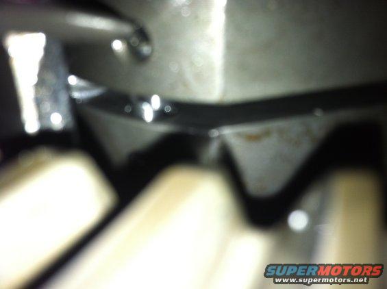 Close-up of gears and metal components with "SUPERMOTORS" text