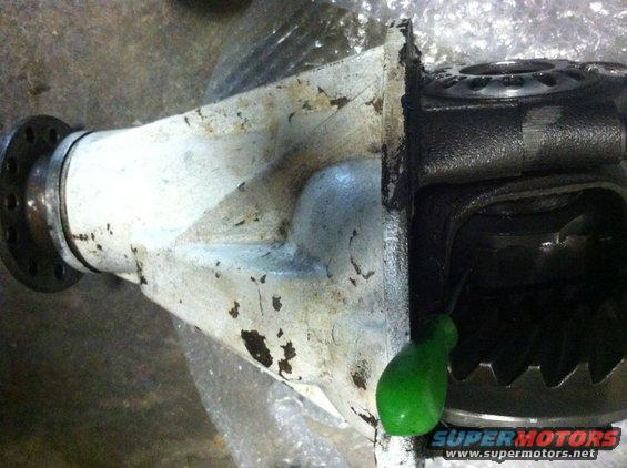 differential housing with gears visible inside, some paint chipped off