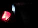 2008 Mercury Grand Marquis - A close-up of a vehicle's red taillight is visible against a dark background.