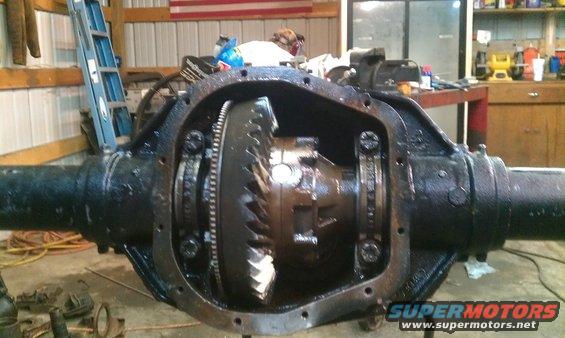 differential housing with gears inside, in a garage setting