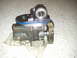 2004 Ford F-350 - This is an oil pump with a visible gear and blue gasket, likely a replacement part.